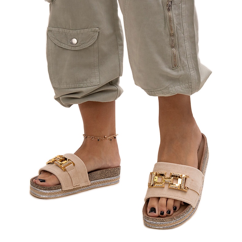 Beige flip-flops with a shiny buckle by Niamh