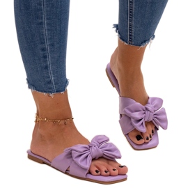Purple flip-flops with a decorative bow by Uwansa violet