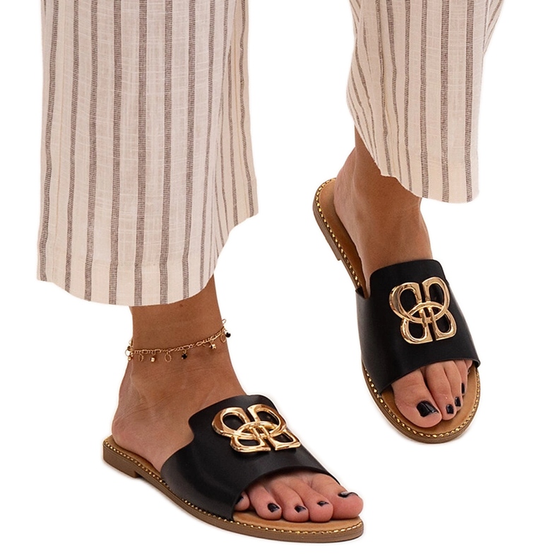 Black flip-flops decorated with a Perkin buckle Black flip-flops decorated with a Perkin buckle