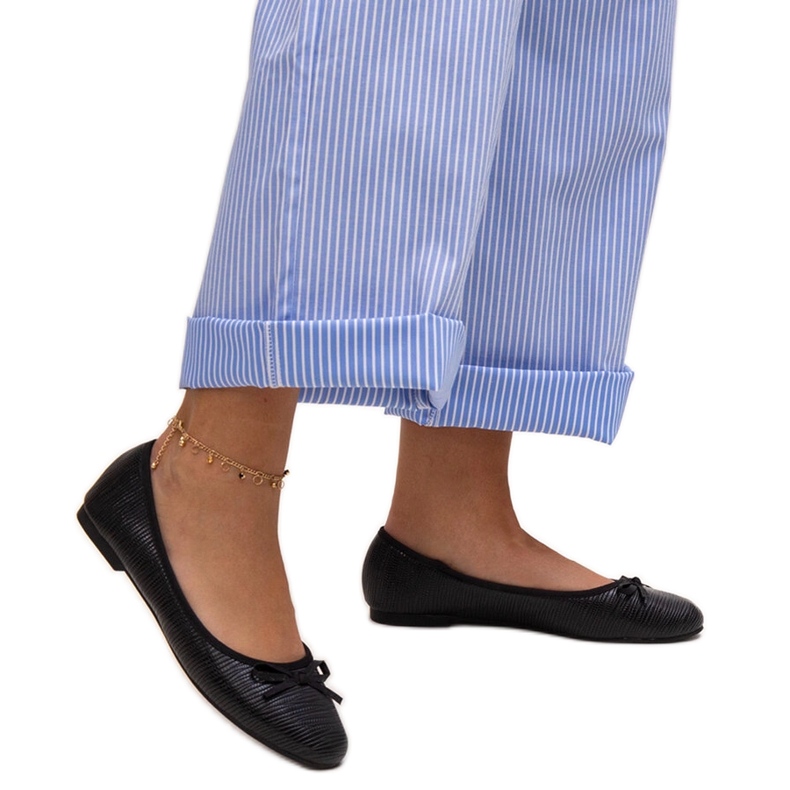 Black ballet flats with a bow and a leather insert by Rosaly