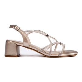 Women's gold sandals with decorative straps by Sergio Leone golden