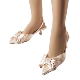 Beige high heels with a Burlington bow