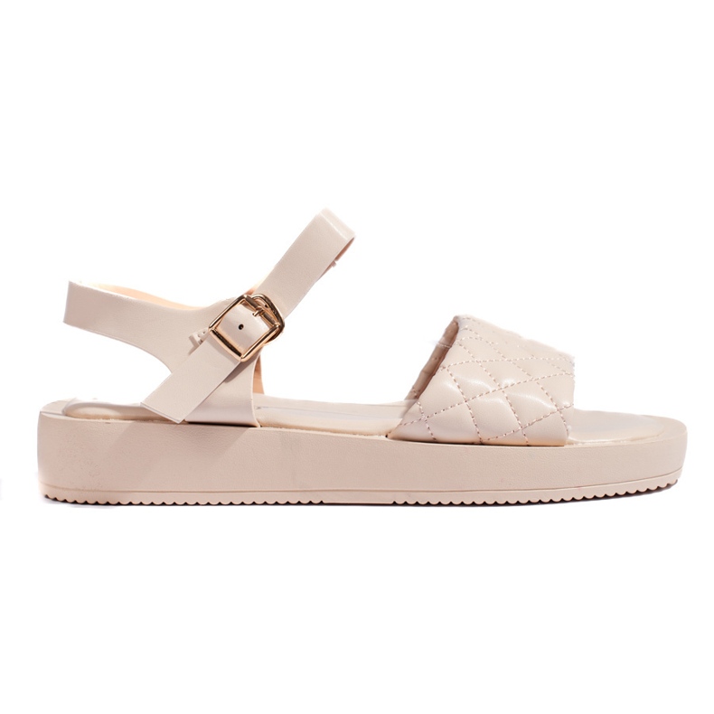 Women's beige sandals on the platform