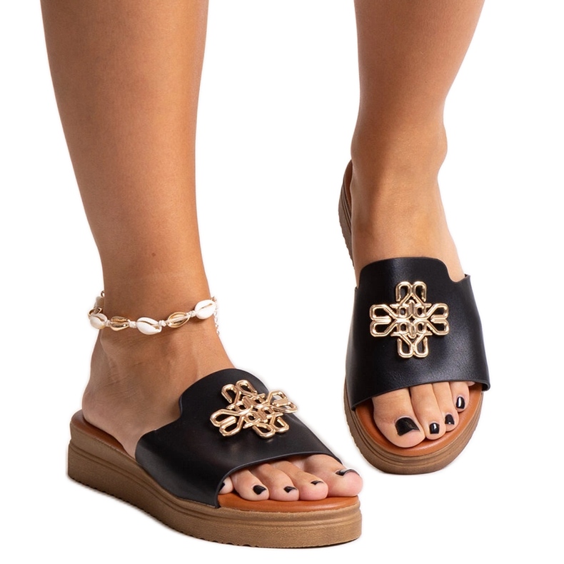 Black platform slides with a Nibal buckle