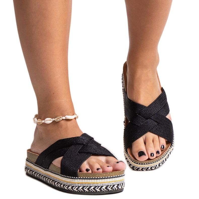 Black flip-flops with a decorative Demet sole Black flip-flops with a decorative Demet sole