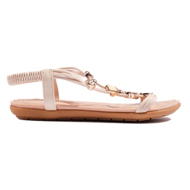 Beige women's flat sandals with decorations