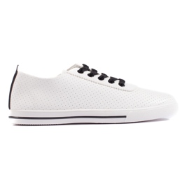 White women's sneakers with black laces