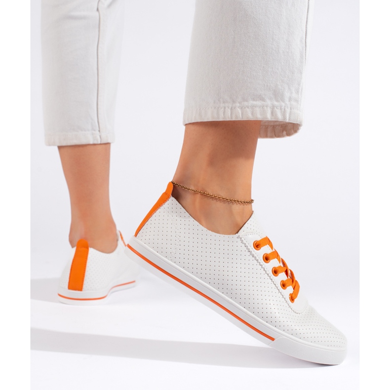 White women's sneakers with orange laces