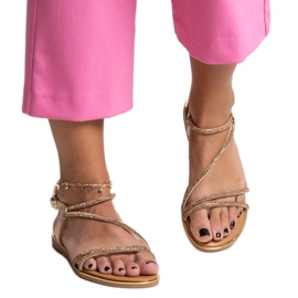 Gold sandals decorated with Caramella zircons golden