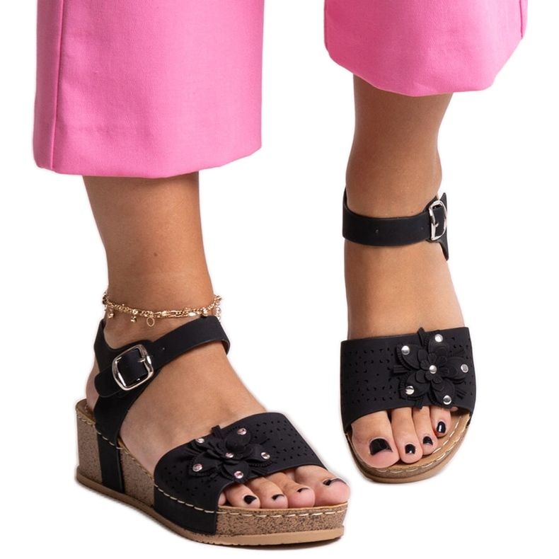 Black wedge sandals with a Kifah flower
