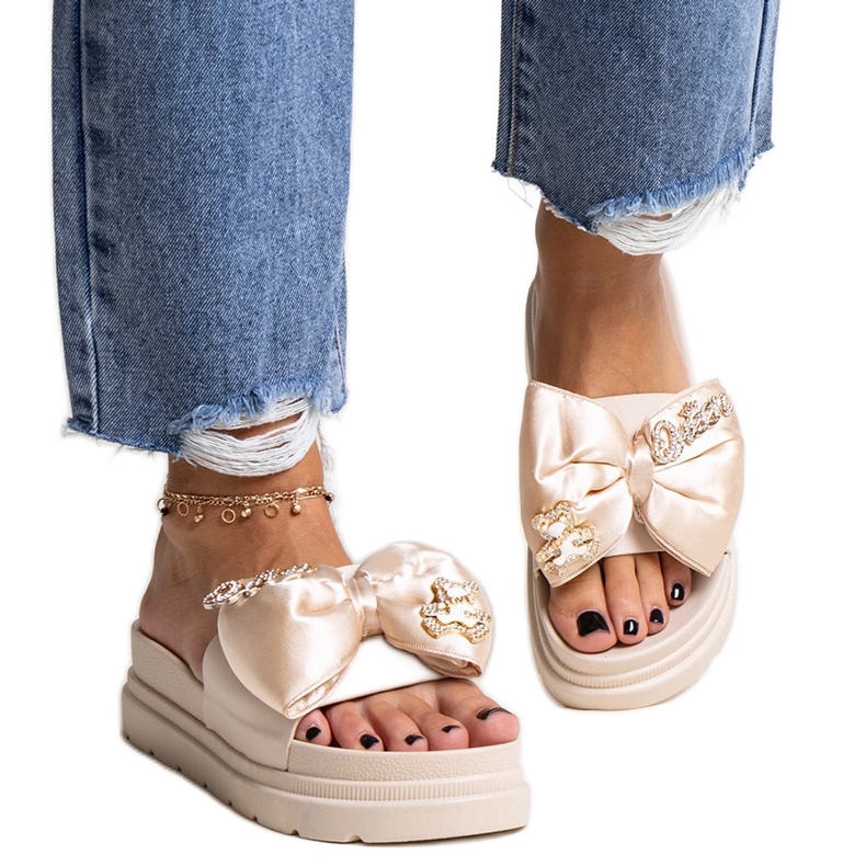 Beige massive flip-flops with a bow, izsa