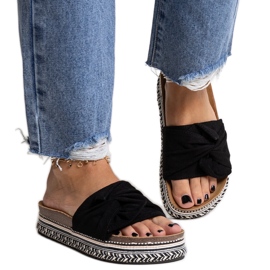 Massive black flip-flops with a decorative Nibalie sole Massive black flip-flops with a decorative Nibalie sole