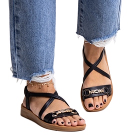 Black sandals with a gold buckle by Pamphila Black sandals with a gold buckle by Pamphila