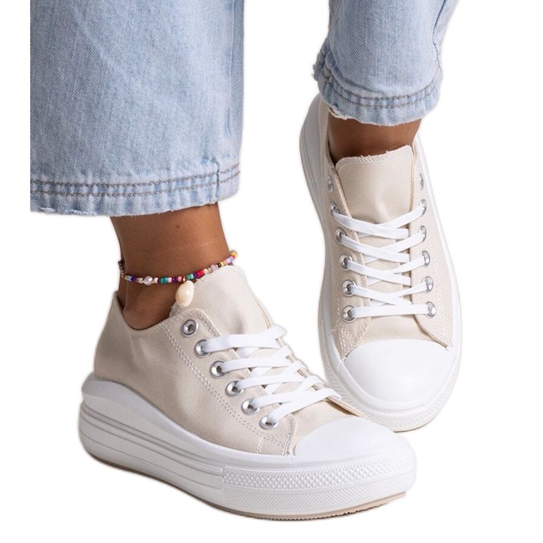 Beige sneakers on a thick Zlata platform