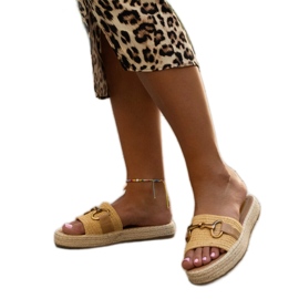 Yellow flip-flops with a gold buckle by Feorie