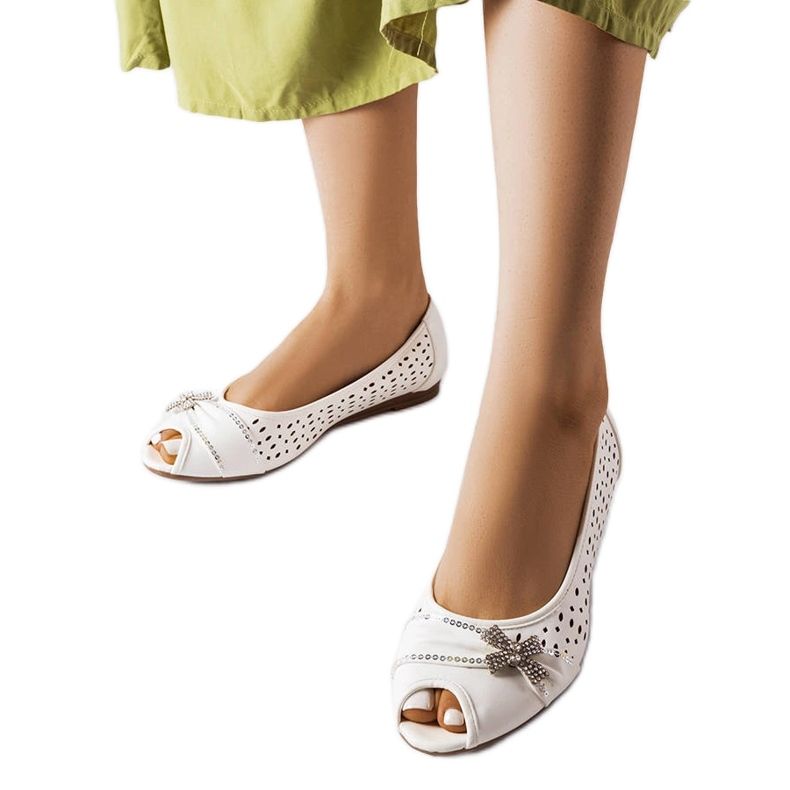 Openwork white ballet flats with a Simpsville bow