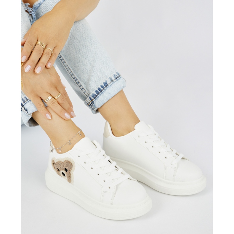 White women's sports shoes with a teddy bear White women's sports shoes with a teddy bear