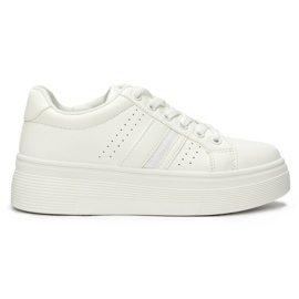 White sports sneakers on the platform
