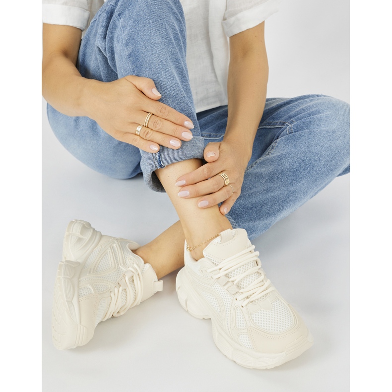 Beige sneakers with a thick sole