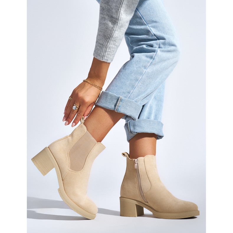Beige suede ankle boots with a block heel