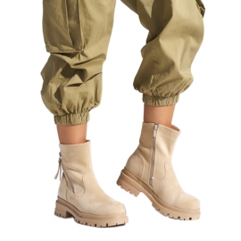 Beige women's ankle boots with a decorative zipper Beige women's ankle boots with a decorative zipper