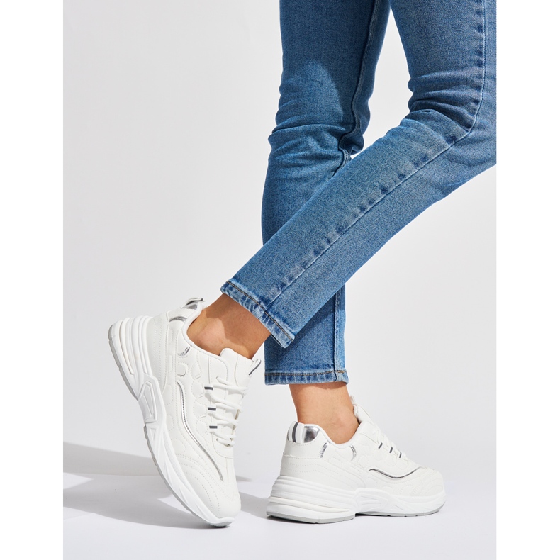White women's sports shoes with a thick sole