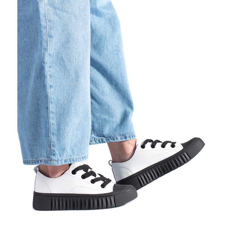 Black and white low sneakers made of genuine leather