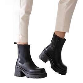 Black ankle boots with a massive Tharney heel Black ankle boots with a massive Tharney heel