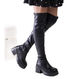 Black insulated boots with a massive Meragomi heel Black insulated boots with a massive Meragomi heel