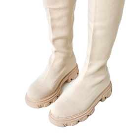 Long beige fabric boots on the Athira platform Long beige fabric boots on the Athira platform