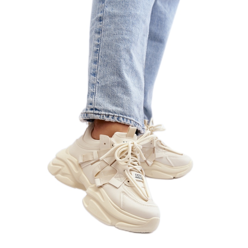 Beige sports shoes with a massive sole
