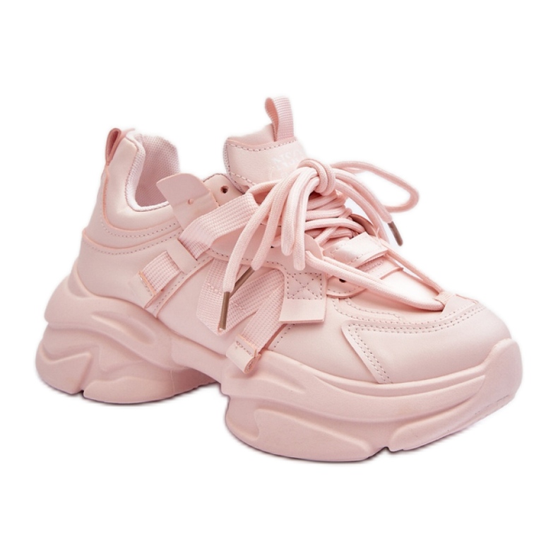 Pink sports shoes with a massive sole
