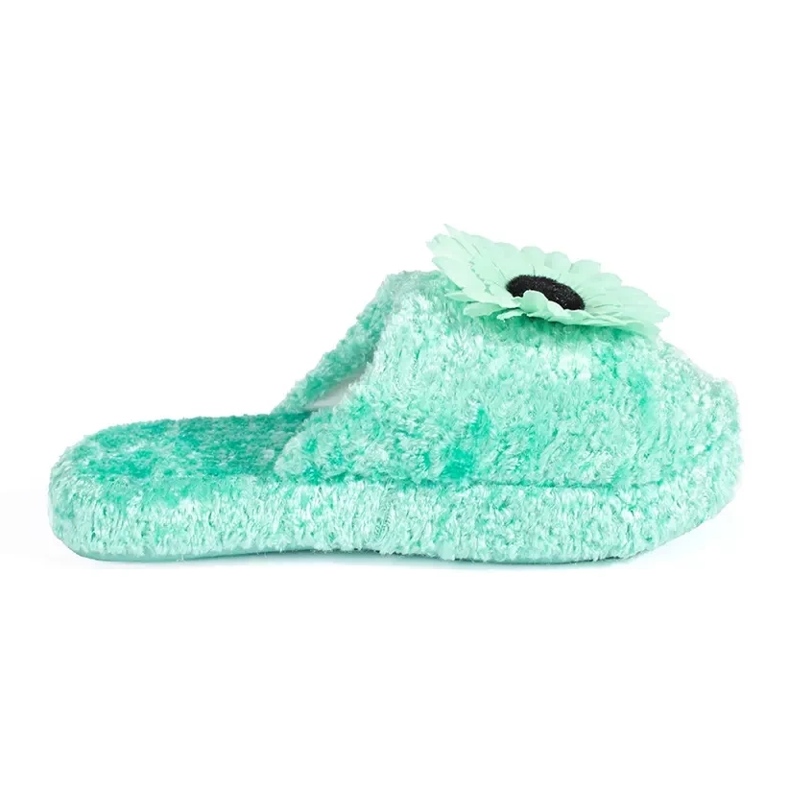 Green children's slippers with a decorative flower Green children's slippers with a decorative flower