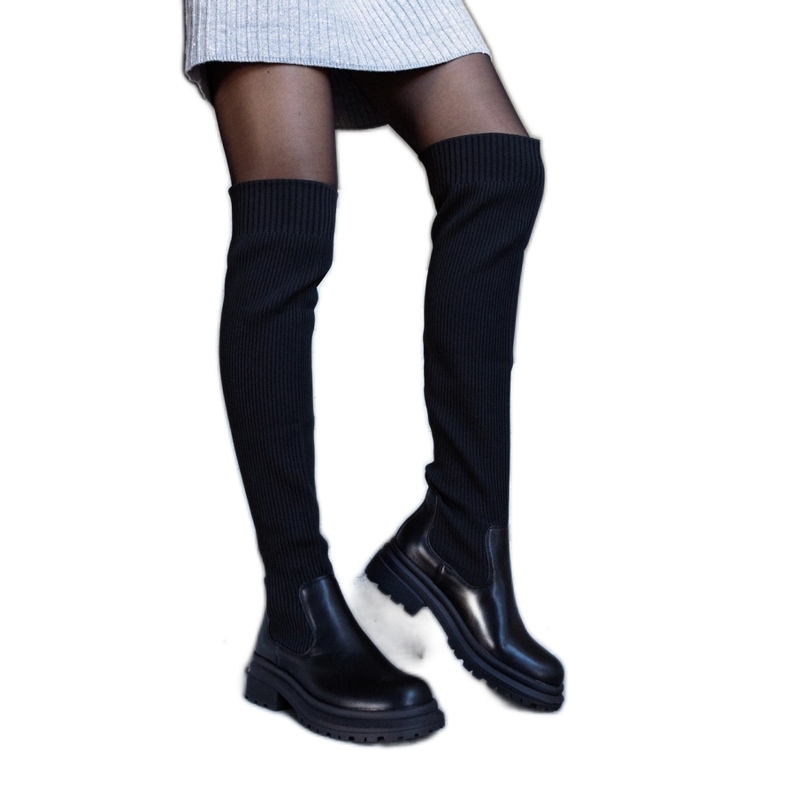 Black long boots with an elastic upper by Daryl