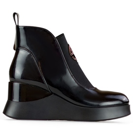 Leather patent leather women's wedge boots. Elegant, insulated women's ankle boots black