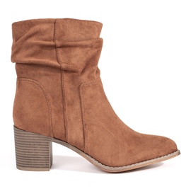 Brown suede ankle boots with a ruffled upper