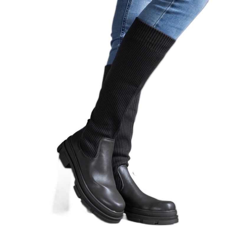 Green slip-on boots with a flexible upper on a massive Elthea sole