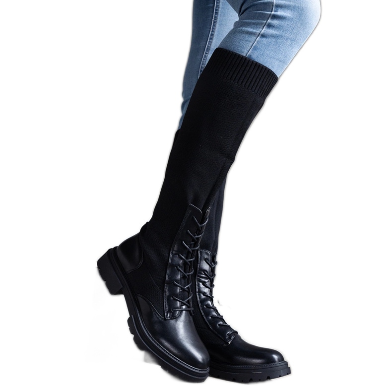 Black slip-on boots with a flexible material upper by Luana