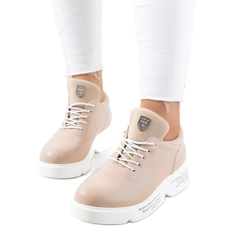 Beige Women's sports sneakers on the platform