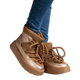 Brown women's snow boots on the platform, insulated with fur