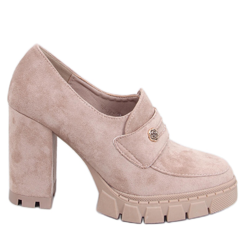 Women's shoes with a high heel and a platform with decoration, beige