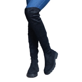 Black long boots with a flexible upper and a flat sole