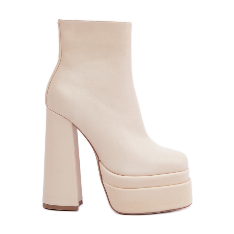 Light beige warm boots on a massive platform and high heel