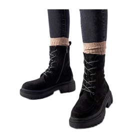 Black worker boots with trappers on a massive Riel - Solea sole Black worker boots with trappers on a massive Riel - Solea sole