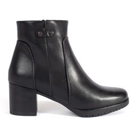 Black high-heeled ankle boots by Sergio Leone