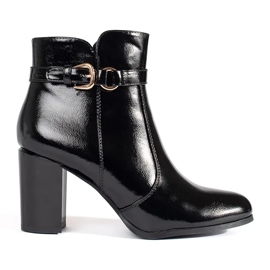 Black patent high-heeled ankle boots by Sergio Leone