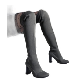 Green slip-on high-heeled boots with a flexible upper Green slip-on high-heeled boots with a flexible upper