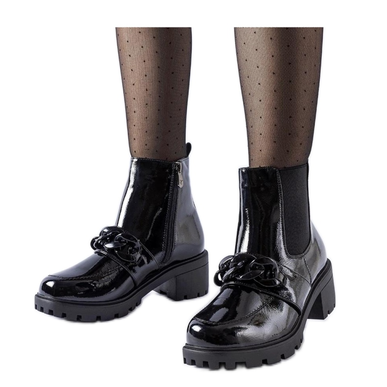 Black patent leather insulated ankle boots with a buckle Black patent leather insulated ankle boots with a buckle