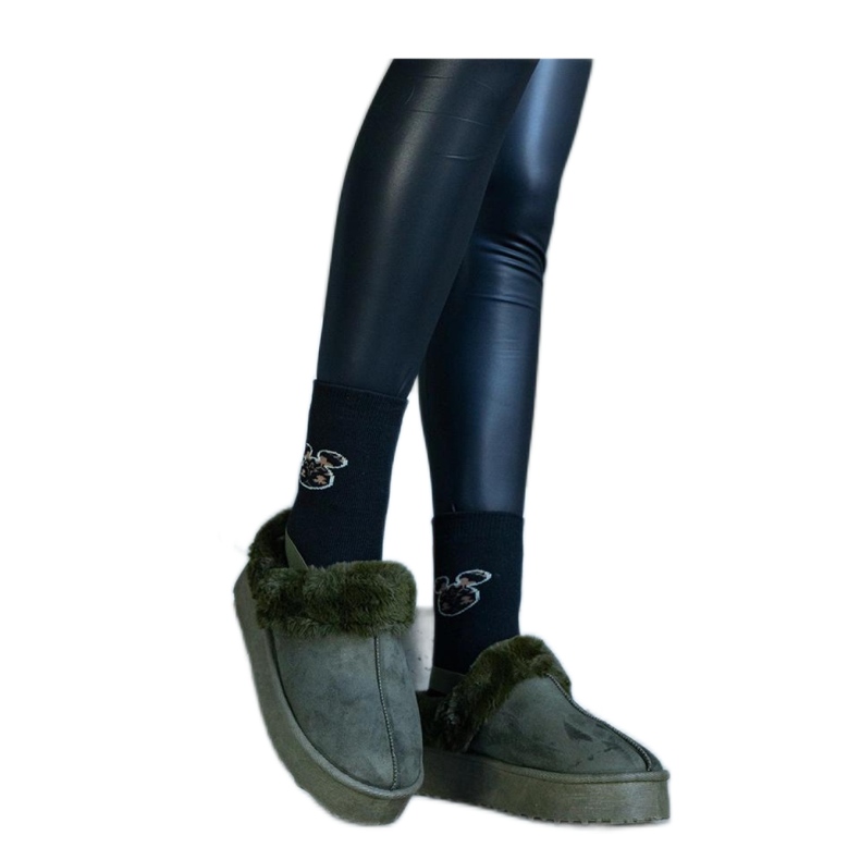 Green platform slippers decorated with fur and with an elastic band at the heel