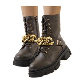 Green hiking boots with a chain